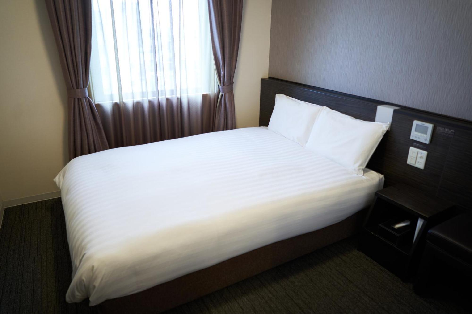 Dormy Inn Higashi Muroran Habitación foto